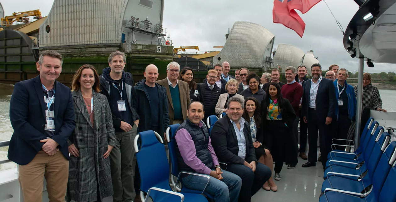 BPA Conference 2023 Delegates on a river trip with the Thames Barrier in the background