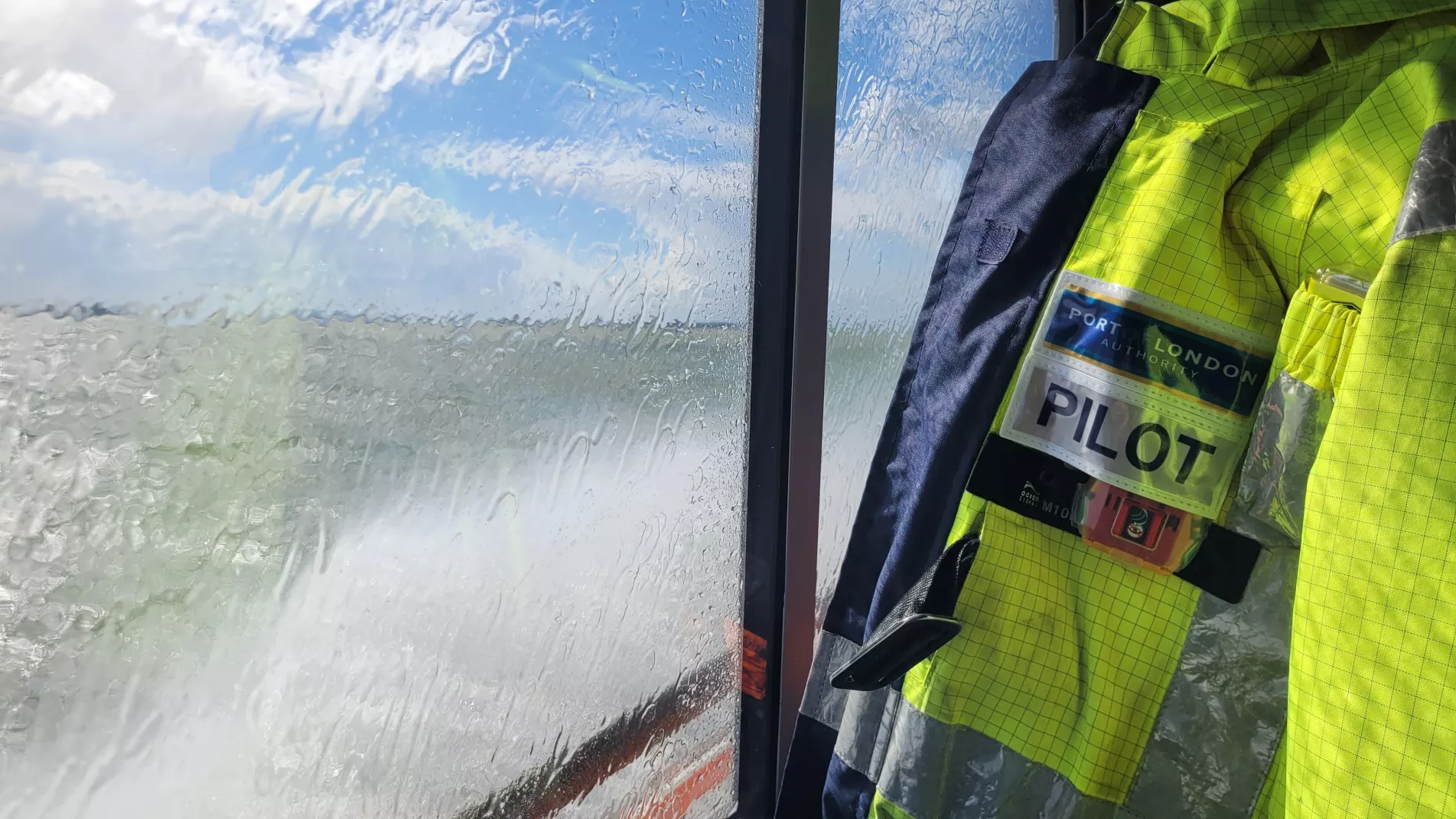 Jack Daly Photo Pilot SeaSafe jacket with Thames through the window