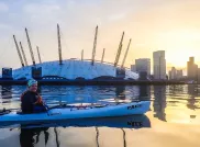 Natalie Maderova on a kayak with the O2 Arena in the background People of the Thames