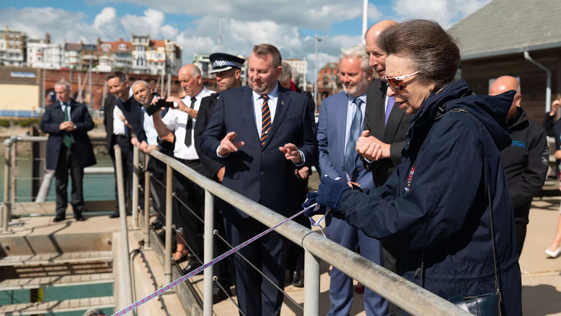 HRH The Princess Royal names Estuary Elise pulling the ribbon with delegates in the background