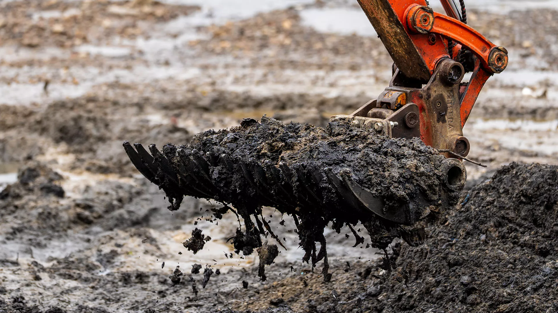 Excavator picking wet wipes off of Wet Wipe Island