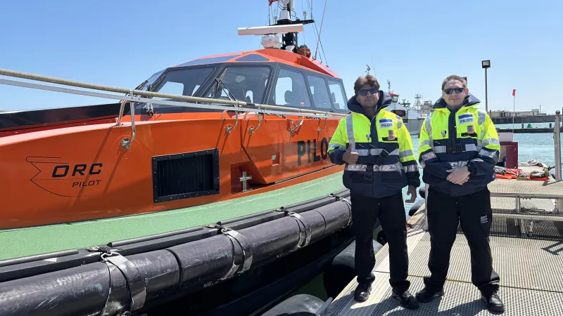 Two new PLA Pilots in front of a Pilot Cutter who joined in July 2025
