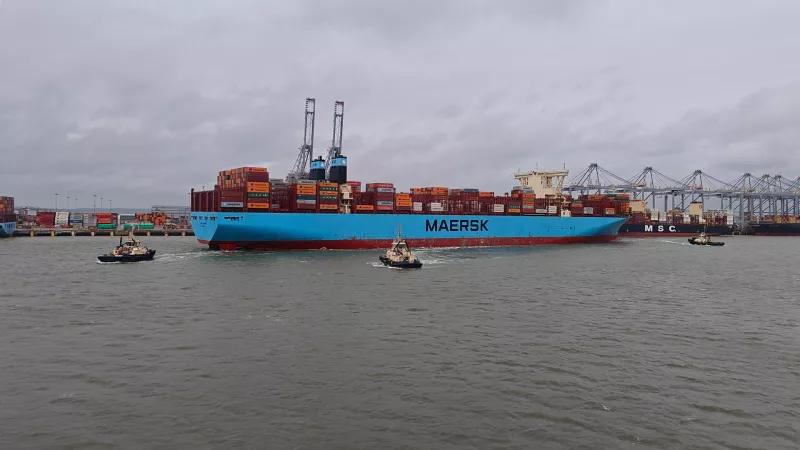 Vessel in the Port of London with three tugs